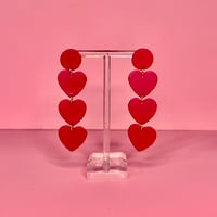 Image 1 of three hearts earrings