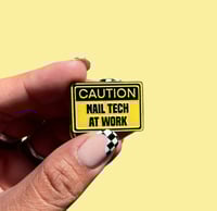 Image 1 of *NEW* Caution: Nail Tech at Work Enamel Pin