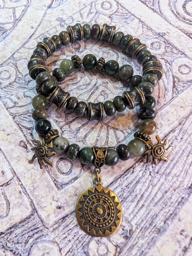 Image of DECOLONIZE IT! ~ Green Snowflake Obsidian and Aztec Sun Stretch Bracelet Set