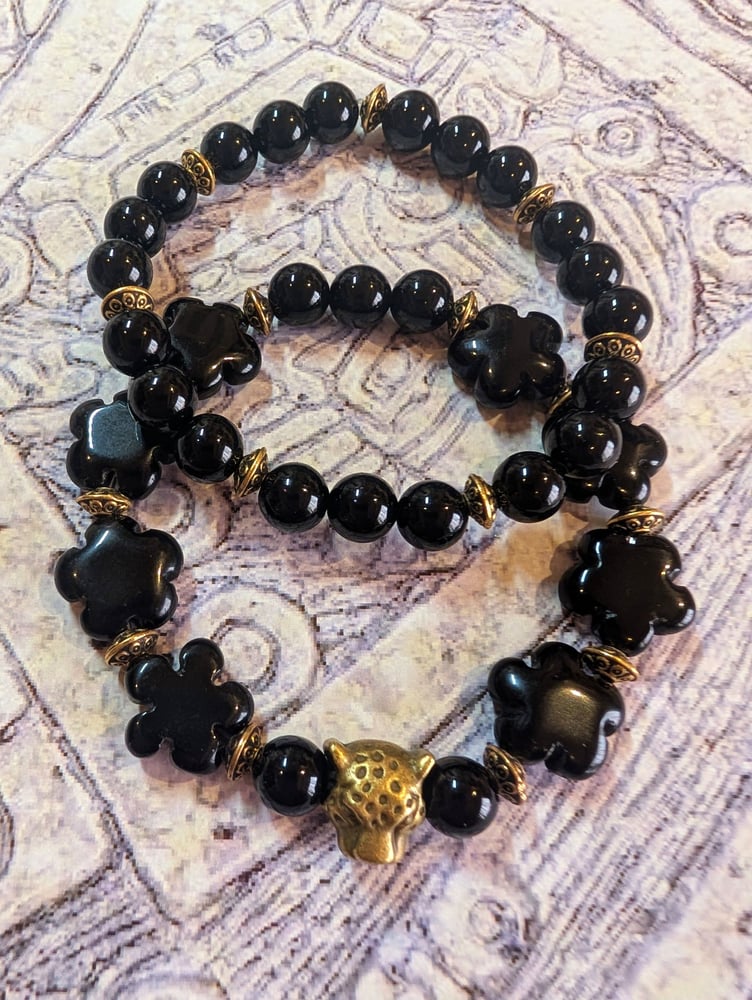 Image of DECOLONIZE IT! ~ Jaguar on Black Black Obsidian Flower Beads Stretch Bracelet Set