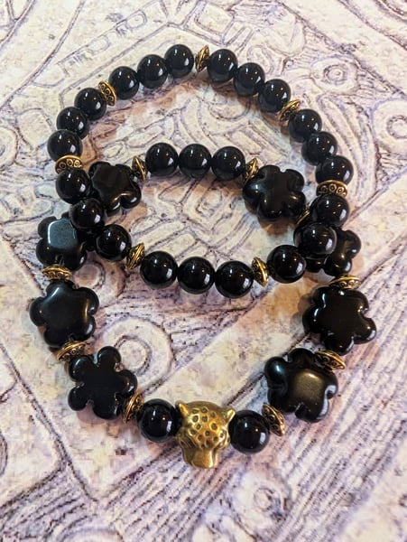 Image of DECOLONIZE IT! ~ Jaguar on Black Black Obsidian Flower Beads Stretch Bracelet Set