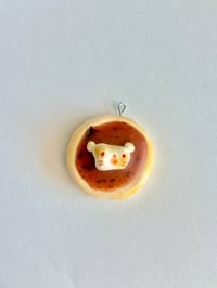 chocolate icing donut with marshmallow bear