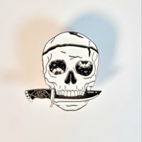Image 1 of Wobbly Eye'd Skull With Spider Web Handled Dagger In Its Mouth Enamel Pin