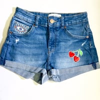 Image 1 of Women's Bershka cut off jean shorts cuffed stretch med wash embellished w-cherries & greek eye patch
