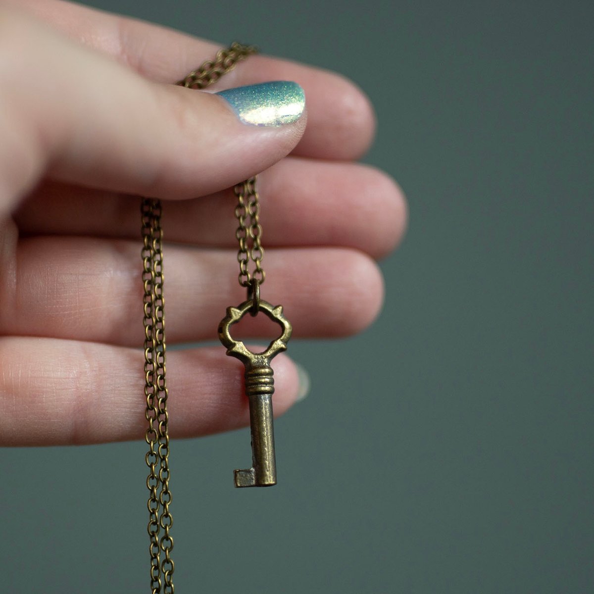 {RESERVED} Tiny ornate brass key necklace