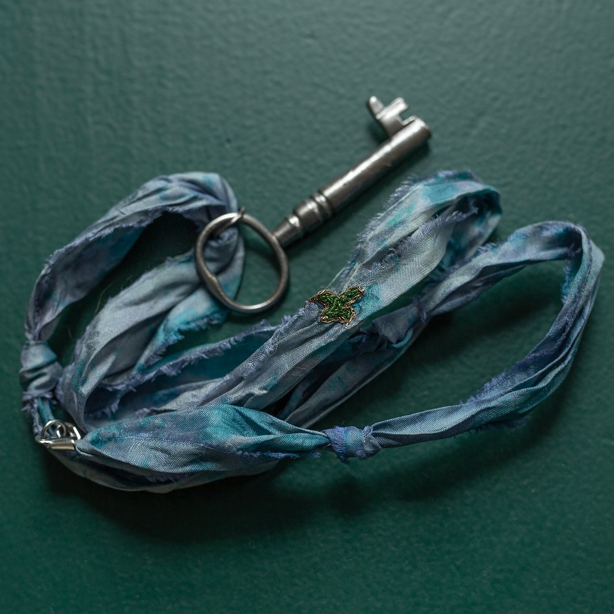 Large key on knotted silk "Dusty Cloud" cord
