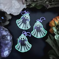 Image 1 of Glow in the Dark Ghost Reading Ghost Stories Key Chain