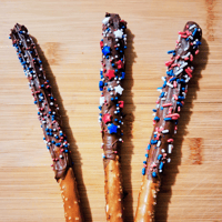 Image 2 of Patriotic Fourth of July Milk Chocolate Dipped Pretzel Rods with Red, White & Blue Embellishments