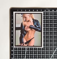 Image 2 of Stunning Blonde In Revealing Leather Jacket And Thong Matte Vinyl Sticker