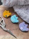 Broches Mochicats 