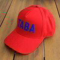 The Rebel TABA – Red Hat with Blue Letters
