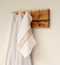 Image 3 of Flip wood coat rack, 4 metallic hooks. From the "Wounded wood" series.