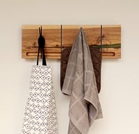 Image 4 of Flip wood coat rack, 4 metallic hooks. From the "Wounded wood" series.