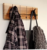 Image 5 of Flip wood coat rack, 4 metallic hooks. From the "Wounded wood" series.