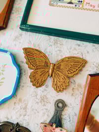 Image 1 of golden butterfly