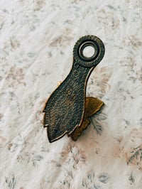 Image 4 of brass butterfly wall clip