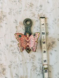Image 5 of brass butterfly wall clip