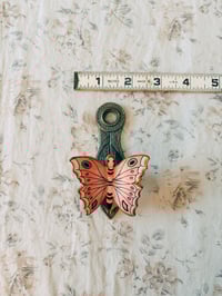 Image 6 of brass butterfly wall clip