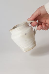 Image 1 of milk jug