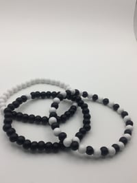 Image 1 of unisex black & white wooden bracelet