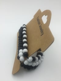 Image 2 of unisex black & white wooden bracelet
