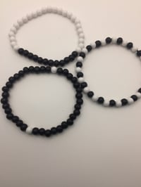 Image 3 of unisex black & white wooden bracelet