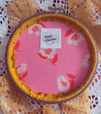 Image 2 of 6” Pink floral embroidery with green leaves on mustard fabric