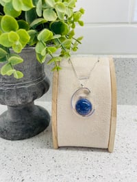 Spiral wave pendant