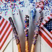 Image 1 of Patriotic Fourth of July Milk Chocolate Dipped Pretzel Rods with Red, White & Blue Embellishments