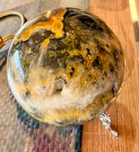 Image 4 of BUMBLEBEE JASPER SPHERE WITH CAVES 6CM