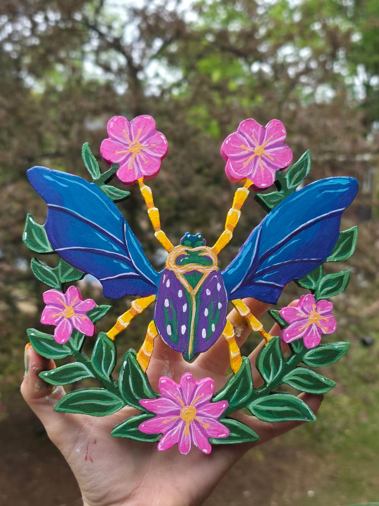 Image of Hand cut beetle wood painting 