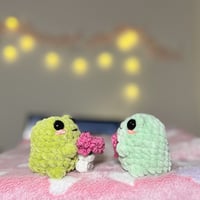 Image 2 of Frog Plushie Crochet Romantic Amigurumi | Handmade Gift Frog | Chubby Frog Holding Heart and Bouquet