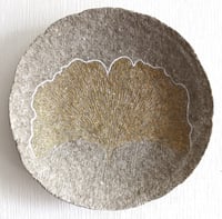Image 1 of Golden ginkgo biloba leaf on a paper mache wall plate.