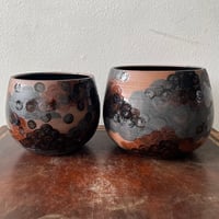 Image 1 of storm planters
