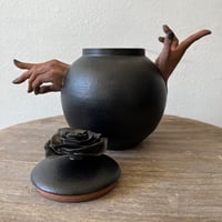 Image 4 of a handheld teapot