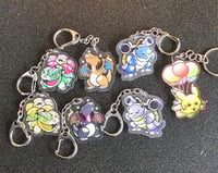 Shiny Charizard, Blastoise, Venusaur, Pikachu double-sided charms (4) Set