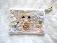 Image 1 of flowers in the snow pouch 