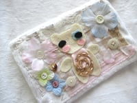 Image 2 of flowers in the snow pouch 