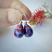 Image 1 of Purple with Orange Drops
