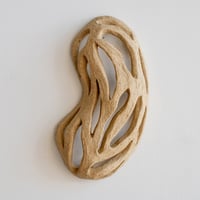 Petite sculpture murale ajourée