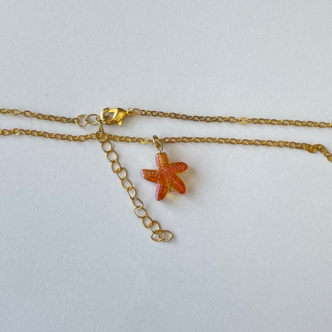 orange starfish gold chain necklace