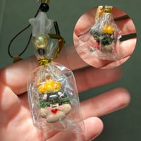 Image 4 of Grass baby wearing fish hats keychains