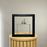 Lady On A Bicycle Balancing Between 2 Stairs 25x25cm