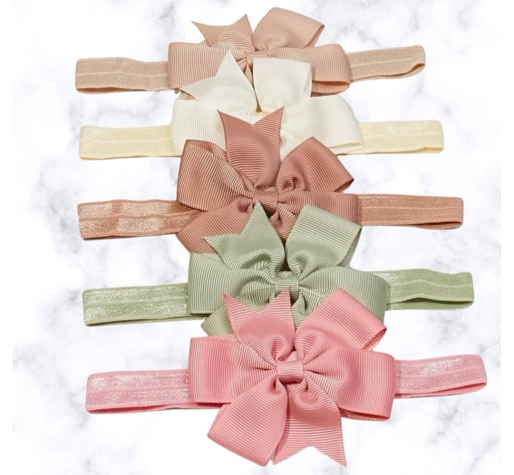 Image of Adorable Baby Bow| Upgrade Your Mini Fashionista's Look| Cute baby bow| Sweet bow| Charming baby bow