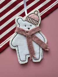 Image 1 of Polar bear with hat and scarf decoration