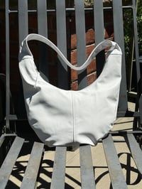 Image 1 of the white round bag