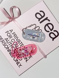 Image 1 of resin oval tags 