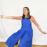 Image 4 of Split Leg Pleated Pinafore Apron with Adjustable Cross Back Straps. Cobalt. No25