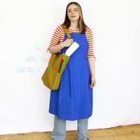 Image 12 of Pleated Split Leg Apron with Adjustable Crossback Straps. Mustard Canvas No25