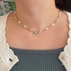 silver bow beige pearl necklace 